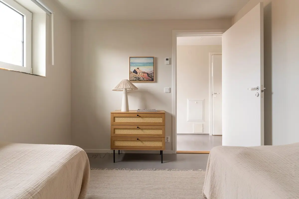 Bedroom 2 with pillows and bedding