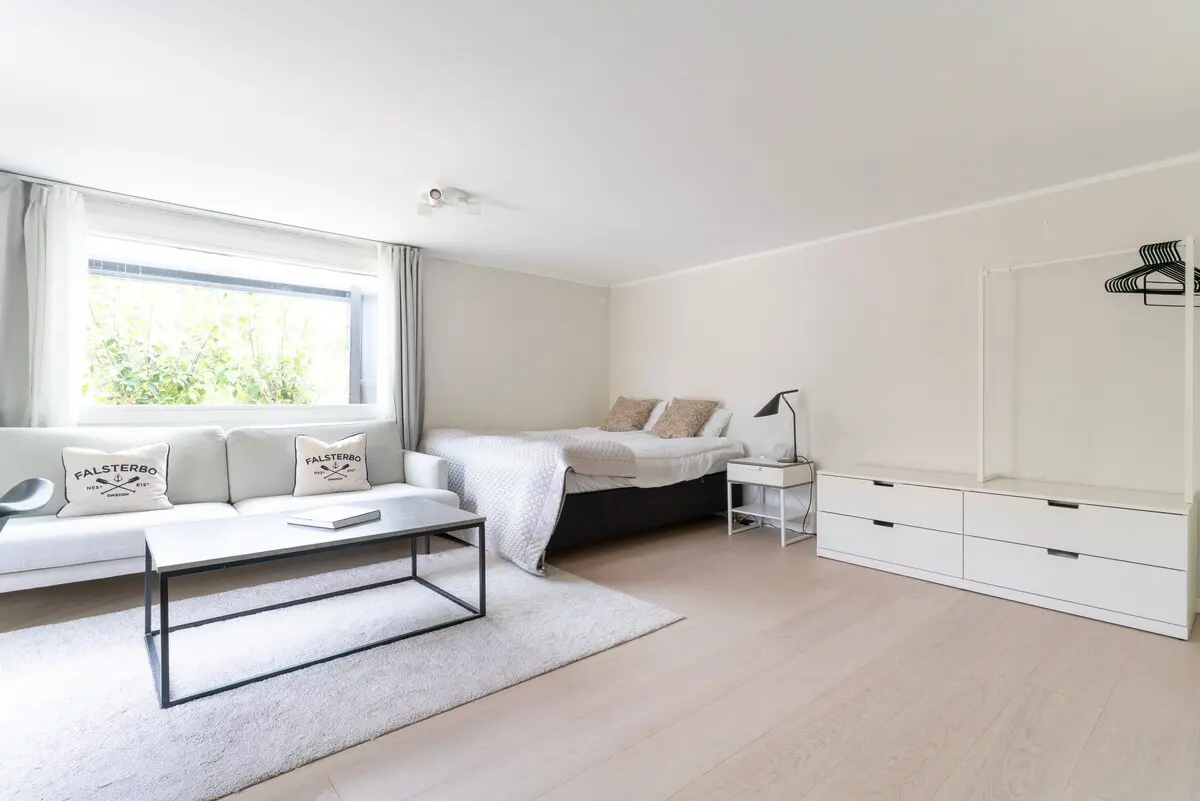 Bedroom with double bed and blackout curtains