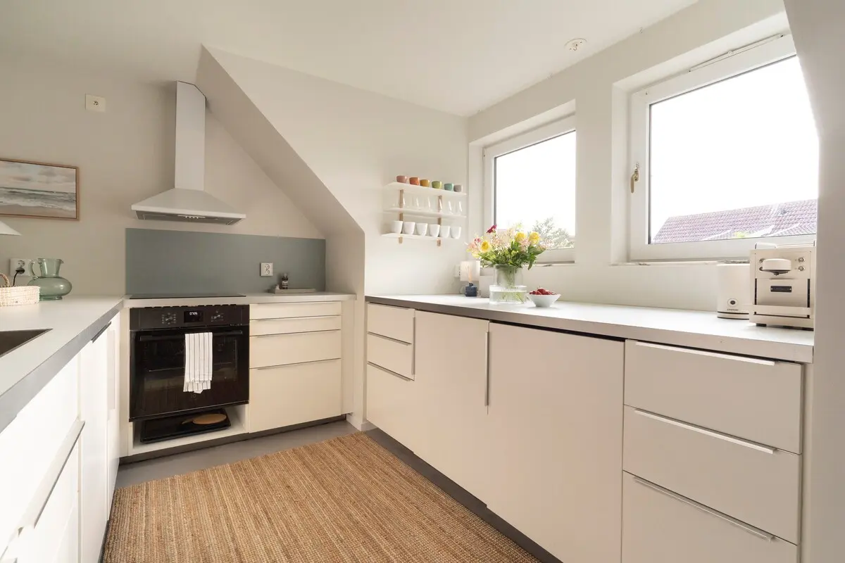Modern white kitchen with induction hob