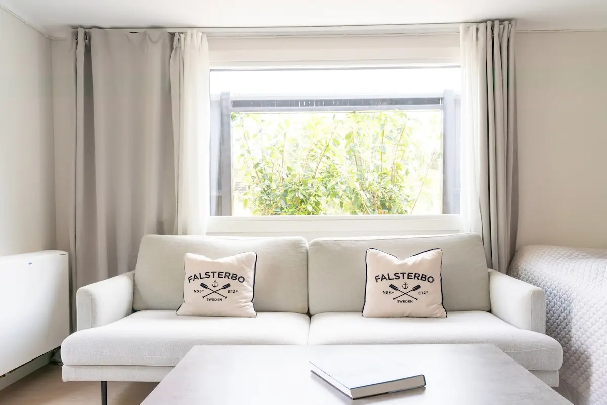 Living room with Falsterbo cushions and garden view