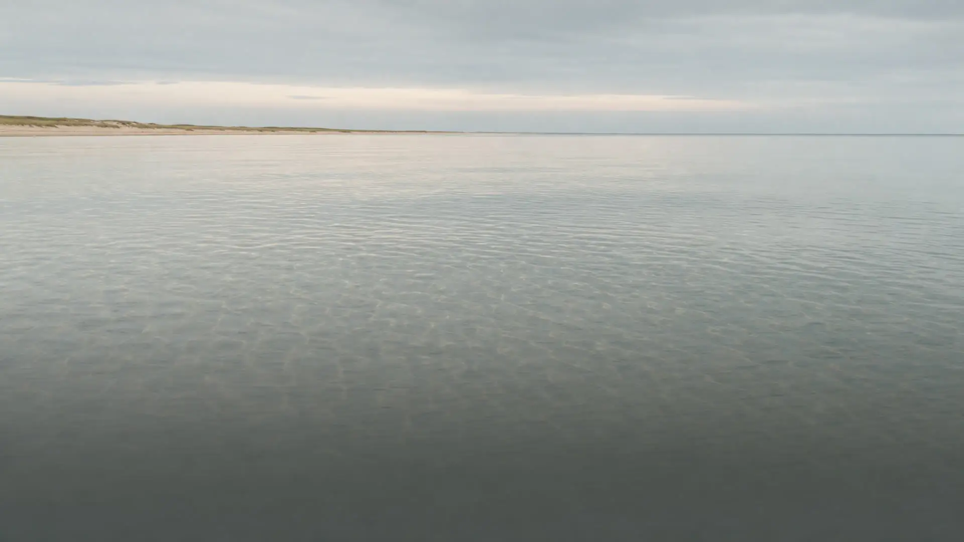 Shallow, clear water over pale sand at Falsterbo on a still day